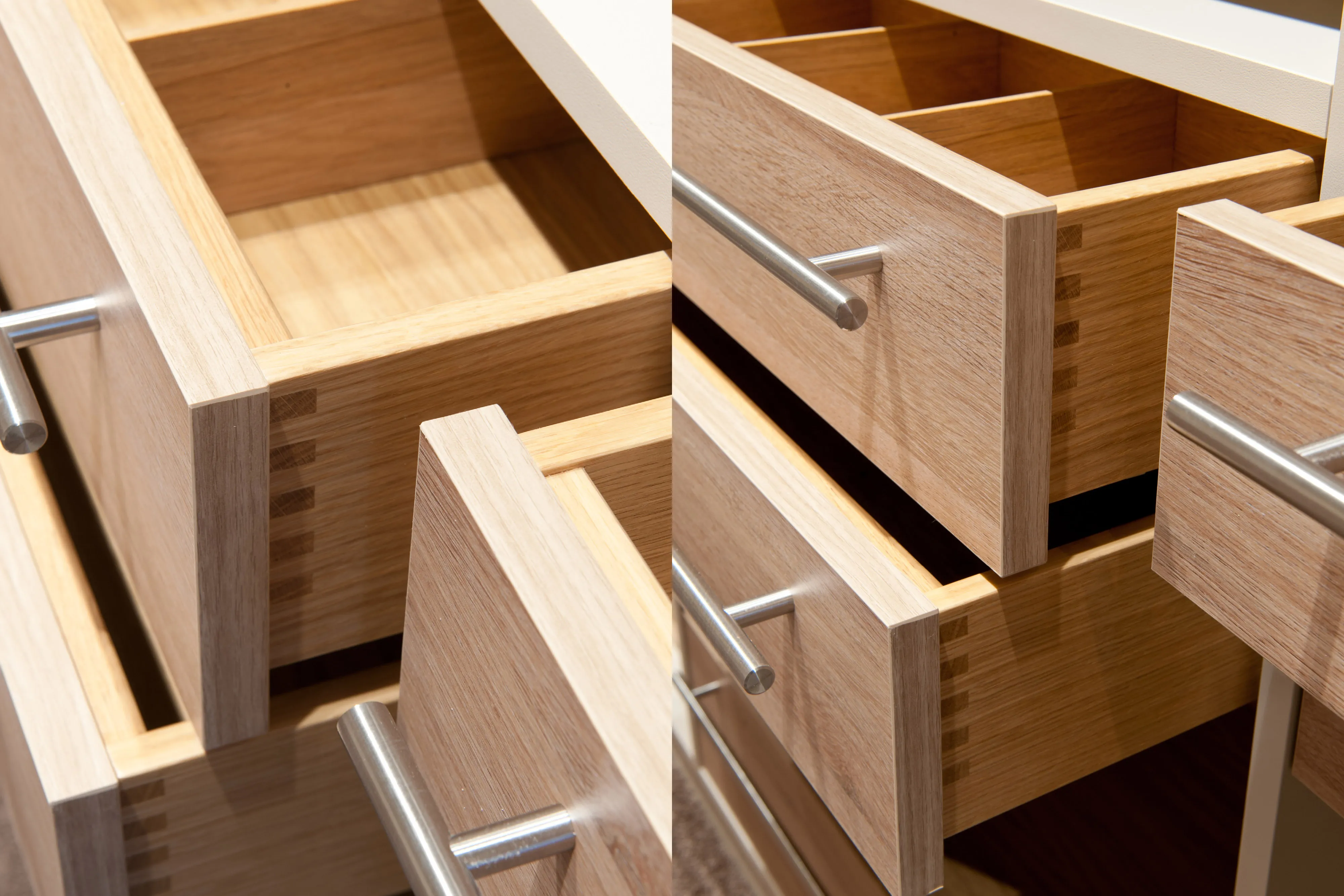 Detailaufnahme verarbeiteter Schubladen aus Massivholz mit gezinkten Eckverbindungen und Metallstangengriffen
